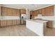 A spacious kitchen features a large island, tile backsplash, and modern appliances that are appealing at 1978 W Lariat Ln, Phoenix, AZ 85085