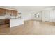 Bright and open living space adjacent to the kitchen, featuring light tile floors and large windows at 1978 W Lariat Ln, Phoenix, AZ 85085