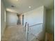 Upstairs loft area with open floor plan and railing overlooking the lower level at 1978 W Lariat Ln, Phoenix, AZ 85085