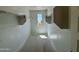 Spacious walk-in closet with shelving, a window for natural light and ample storage at 1978 W Lariat Ln, Phoenix, AZ 85085