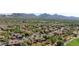 Aerial view of community homes surrounded by mature trees with a beautiful mountain backdrop at 20750 N 87Th St # 2074, Scottsdale, AZ 85255