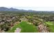 Aerial view of community golf course featuring lush greens and beautiful mountain views at 20750 N 87Th St # 2074, Scottsdale, AZ 85255