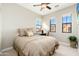 Cozy bedroom with tan color palette, ceiling fan, and bright windows at 20750 N 87Th St # 2074, Scottsdale, AZ 85255