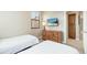 Charming bedroom featuring twin beds, dresser, and a view from the window at 20750 N 87Th St # 2074, Scottsdale, AZ 85255