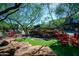 Sculpture of coyote is featured above a rock waterfall with rocking chairs at 20750 N 87Th St # 2074, Scottsdale, AZ 85255