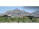 Community view of desert landscape with rocky mountain background and bank building at 20750 N 87Th St # 2074, Scottsdale, AZ 85255