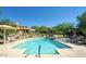 Community pool with sun loungers and cactus accents, set against the backdrop of luxury homes at 20750 N 87Th St # 2074, Scottsdale, AZ 85255
