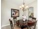 Elegant dining area featuring a round table, sophisticated chairs, and decorative lighting fixture at 20750 N 87Th St # 2074, Scottsdale, AZ 85255