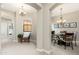 Inviting hallway leading to a charming dining room, with a chair to rest in the wide space at 20750 N 87Th St # 2074, Scottsdale, AZ 85255