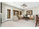 Cozy living room featuring neutral tones, large windows with neighborhood views and balcony access at 20750 N 87Th St # 2074, Scottsdale, AZ 85255