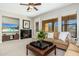 Relaxing living room with a fireplace, a large flatscreen TV, and comfortable seating at 20750 N 87Th St # 2074, Scottsdale, AZ 85255