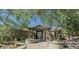 Stone entrance with pergola over the gated entry to the community pool area at 20750 N 87Th St # 2074, Scottsdale, AZ 85255