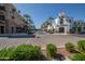 Street view featuring commercial storefronts and palm trees on a sunny day at 20911 W White Rock Rd, Buckeye, AZ 85396