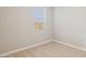 Neutral bedroom featuring plush carpeting and a window for natural light at 21068 N 58Th St, Phoenix, AZ 85054