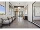 Hallway with chairs, stone accents, and an art display leading to the building's entrance at 21068 N 58Th St, Phoenix, AZ 85054