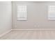 Neutral bedroom with two windows providing natural light at 21130 N 58Th St, Phoenix, AZ 85054