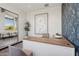 Modern reception area featuring stylish desk, contemporary artwork, and views into hallway with comfortable seating at 21130 N 58Th St, Phoenix, AZ 85054