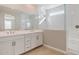 Bright bathroom features double vanity with modern fixtures and a spacious glass-enclosed shower at 21240 N 58Th St, Phoenix, AZ 85054