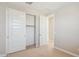 Standard bedroom with neutral carpet, walls, and trim with a closet to the left at 21240 N 58Th St, Phoenix, AZ 85054