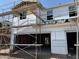 New construction home featuring two-car garage and visible framework, showing progress of the building's elevation at 21240 N 58Th St, Phoenix, AZ 85054
