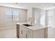 Kitchen island with stainless steel dishwasher and sink, and abundant cabinet space below at 21240 N 58Th St, Phoenix, AZ 85054