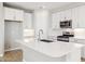 Bright kitchen with stainless steel appliances, quartz countertops, and an undermount sink at 21240 N 58Th St, Phoenix, AZ 85054