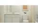 Clean bathroom with white vanity, modern mirror, and contemporary toilet at 25069 N 174Th Ln, Surprise, AZ 85387