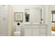Bright bathroom with white vanity, a walk in shower, and modern fixtures at 25069 N 174Th Ln, Surprise, AZ 85387
