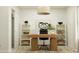 Well-lit home office with modern desk, shelving, and comfortable work space at 25069 N 174Th Ln, Surprise, AZ 85387
