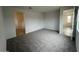 Spacious bedroom with neutral carpet and paint with doorways to closet and other rooms at 25170 W Wayland Dr, Buckeye, AZ 85326
