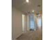 Bright hallway with recessed lighting and neutral colored walls leading to other rooms in the home at 25170 W Wayland Dr, Buckeye, AZ 85326
