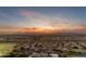 Expansive aerial view capturing a residential area during a beautiful sunset, highlighting community and tranquility at 2742 W Monterey Pl, Chandler, AZ 85224
