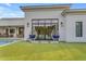 Spacious backyard with turf and hanging chairs near the home's patio area at 2742 W Monterey Pl, Chandler, AZ 85224