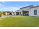 Lush backyard with sprawling turf, modern architecture, and poolside lounge area at 2742 W Monterey Pl, Chandler, AZ 85224