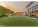 Expansive backyard with a pool, luxurious cabana, and stylish hanging chairs, perfect for outdoor relaxation and entertaining at 2742 W Monterey Pl, Chandler, AZ 85224
