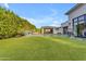 Backyard with lush turf, private pool, outdoor kitchen and poolside lounge area at 2742 W Monterey Pl, Chandler, AZ 85224