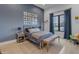 Charming bedroom with blue accent wall, twin bed, and a window offering views of the neighborhood at 2742 W Monterey Pl, Chandler, AZ 85224