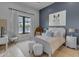 Beautiful bedroom featuring a bright window and calming color scheme creating a relaxing atmosphere at 2742 W Monterey Pl, Chandler, AZ 85224