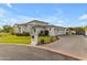 Elegant single-story home featuring a circular driveway, well-manicured lawn, and a prominent address marker at 2742 W Monterey Pl, Chandler, AZ 85224