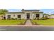 Modern home with manicured landscaping, green lawn, and a unique geometric design front door at 2742 W Monterey Pl, Chandler, AZ 85224