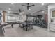 Expansive game room with ping pong and foosball tables, and a glass-walled workout area at 2742 W Monterey Pl, Chandler, AZ 85224