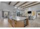 Open concept kitchen with large island, stainless appliances, custom cabinetry, and flows into living space at 2742 W Monterey Pl, Chandler, AZ 85224