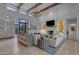 Bright living room with high ceilings, beams, fireplace and stylish furnishings at 2742 W Monterey Pl, Chandler, AZ 85224