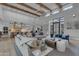 Open-concept living area with high ceilings, exposed beams, bright interiors, and expansive windows at 2742 W Monterey Pl, Chandler, AZ 85224