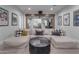Recreational room with movie posters and a long sofa in front of a large partition at 2742 W Monterey Pl, Chandler, AZ 85224