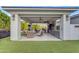 Expansive outdoor kitchen with built-in grill, bar seating, and stylish furniture for ultimate outdoor enjoyment at 2742 W Monterey Pl, Chandler, AZ 85224