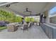 Spacious outdoor kitchen with modern appliances, comfortable seating, and ample counter space for outdoor cooking at 2742 W Monterey Pl, Chandler, AZ 85224