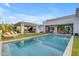 Stunning backyard oasis featuring a sparkling pool, lounge area, and outdoor kitchen, perfect for entertaining at 2742 W Monterey Pl, Chandler, AZ 85224