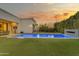 Tranquil backyard with a sparkling pool and mature landscaping providing privacy and a relaxing ambiance at 2742 W Monterey Pl, Chandler, AZ 85224