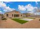 Beautiful backyard featuring an artificial turf area, perfect for outdoor activities and entertainment at 30303 W Whitton Ave, Buckeye, AZ 85396